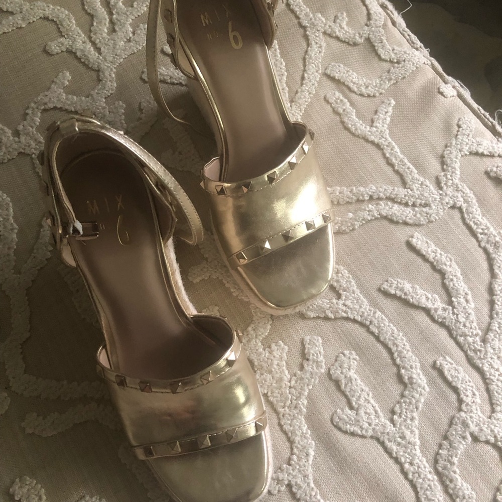 Ladies wedge with ankle strap size 8. Worn one time.